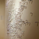 Illustration for article titled Mysterious, tiny human figures march across a wall